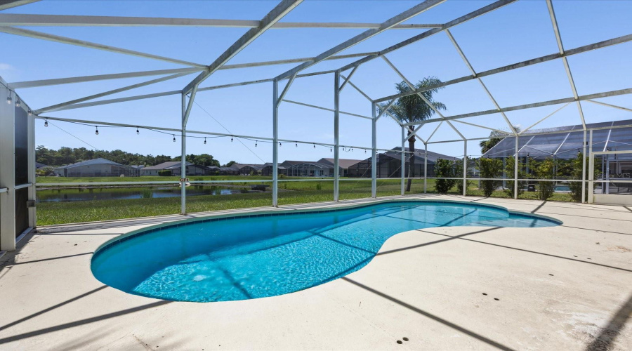 Screened in pool area with water view