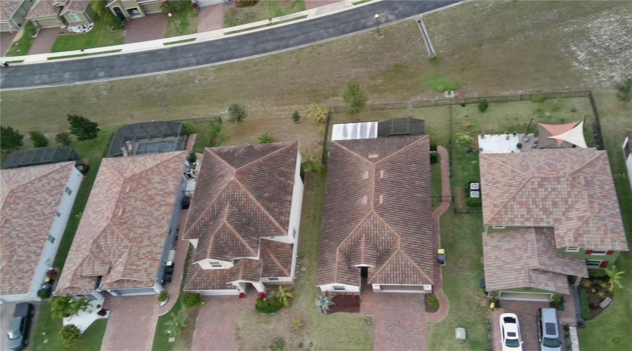 Home is second from the right.  Notice fully fenced in yard and screened in enclosure for back patio area.  paver walkway to the backyard area.  All of these make this home have that enhanced living experience you are looking for.