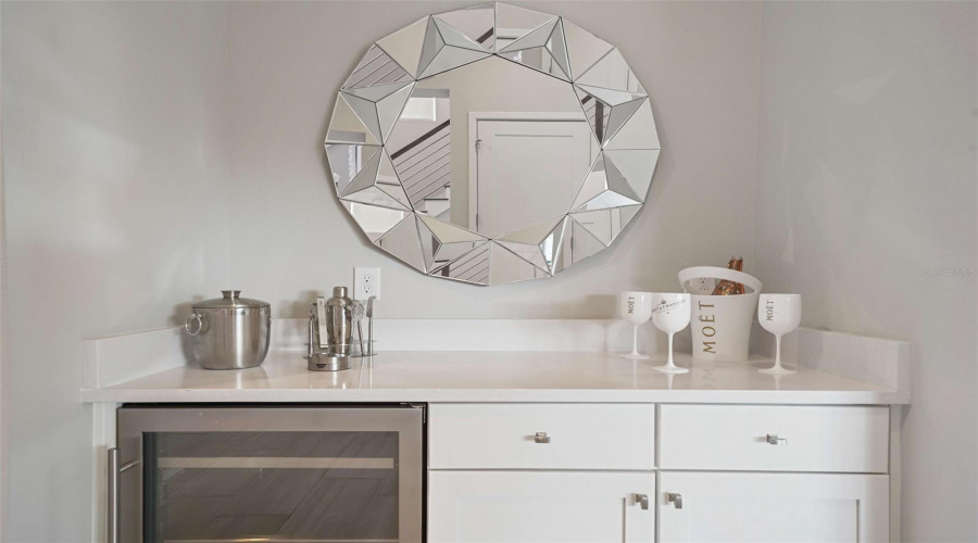 A private bar cabinet adds convenience and flair, perfect for guest enjoyment.