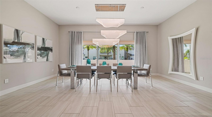 A spacious open-concept living area seamlessly connects the kitchen and dining spaces, perfect for entertaining and guest enjoyment.