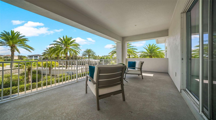 The upstairs primary bedroom features a private balcony overlooking the resort-style backyard, an ensuite bathroom with dual vanities%2