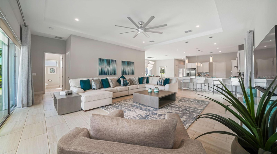 A spacious open-concept living area seamlessly connects the kitchen and dining spaces, perfect for entertaining and guest enjoyment.