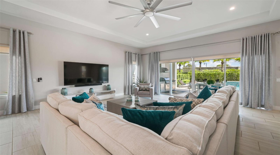 A spacious open-concept living area seamlessly connects the kitchen and dining spaces, perfect for entertaining and guest enjoyment.