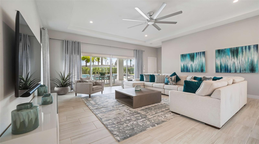 A spacious open-concept living area seamlessly connects the kitchen and dining spaces, perfect for entertaining and guest enjoyment.