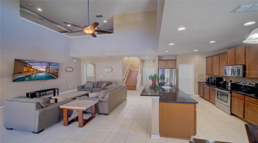 Kitchen and Living Room Showing Staircase Location