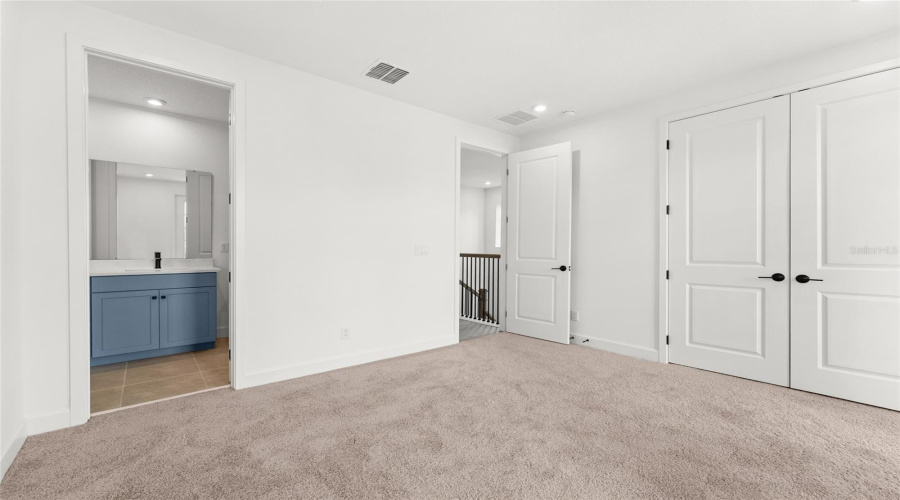 Bedroom 2  features direct access to a Jack and Jill bathroom, shared with an adjacent room.