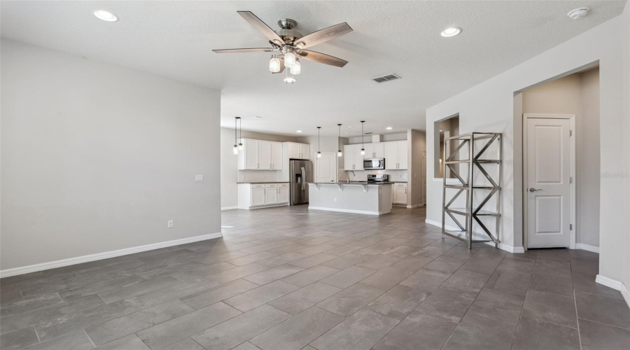 Open  to Kitchen and steps to Primary Bedroom