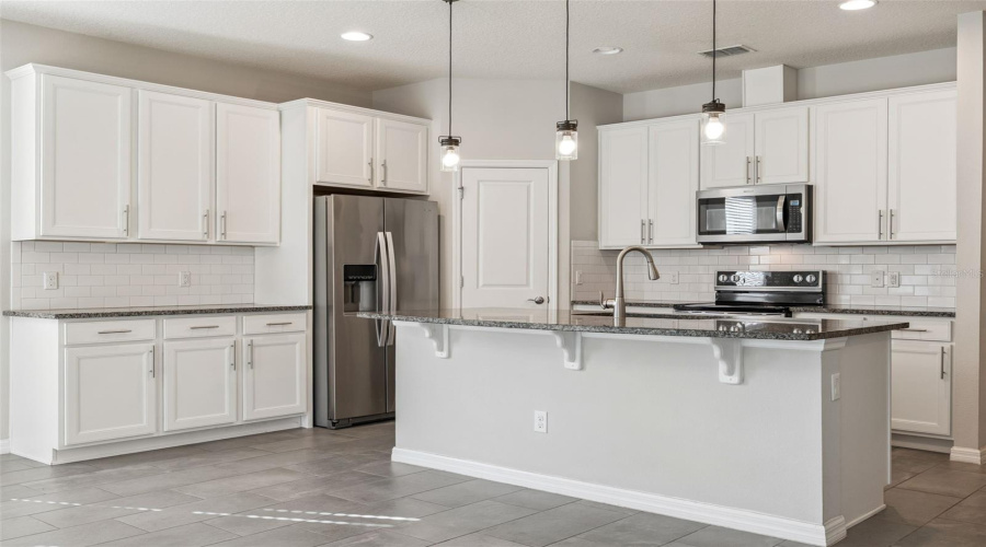 Shaker Cabinets with Granite  Counters & Subway Tile Backsplash!