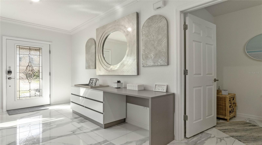 Half bathroom at entry.