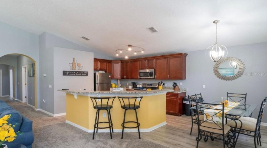 Kitchen with island and formal dining area