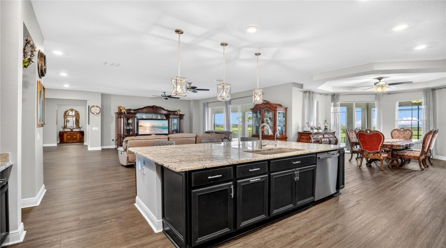 Open-concept layout showcasing the kitchen island, dining area, and main living space, ideal for everyday living and entertaining.