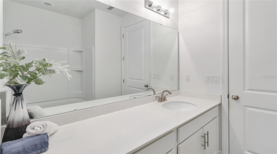 Hall bathroom with solid counters