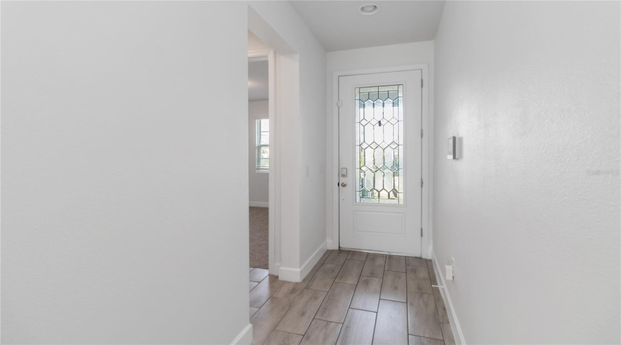 Greet guest in the front hallway