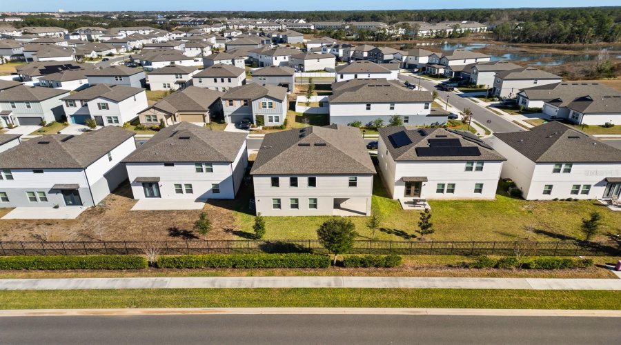 Aerial view of the property and community