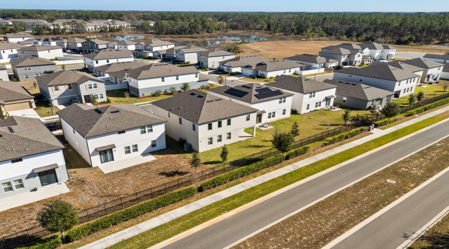 Aerial view of the property and community