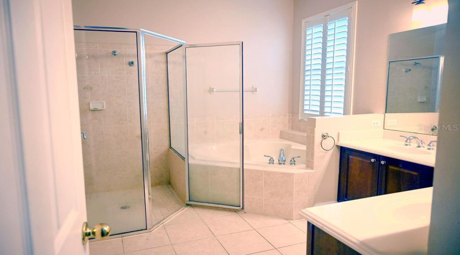 Primary bathroom has a standing shower, garden tub, dual sinks, water closet and lots of counter space.