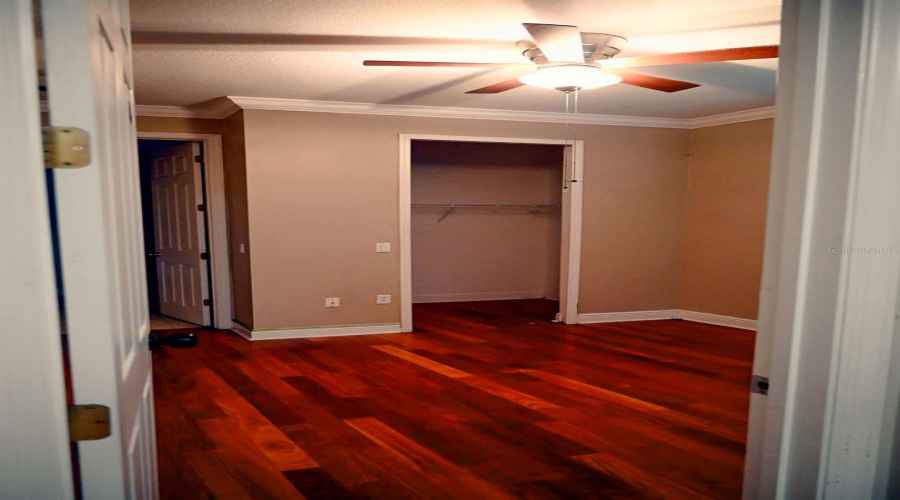 Third bedroom with in-suite bathroom. Floors are not red.