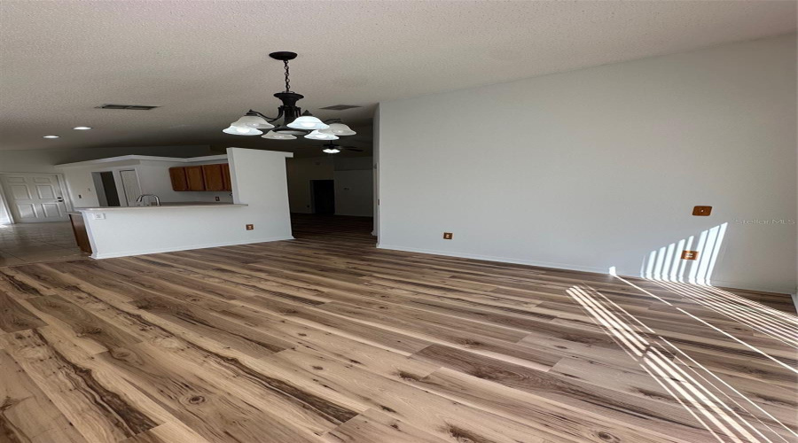 Dining room with updated flooring and paint.