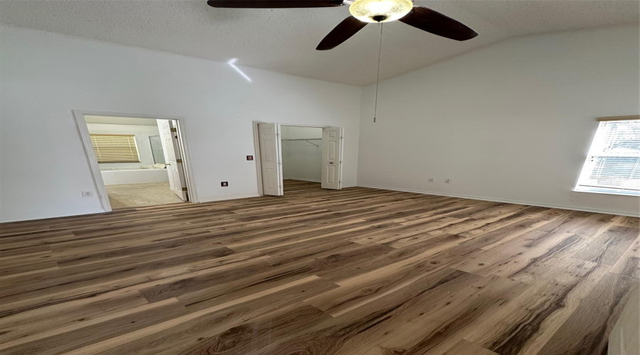 Primary with updated flooring and paint.