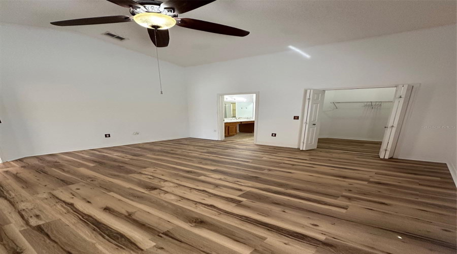 Primary with updated flooring and paint.