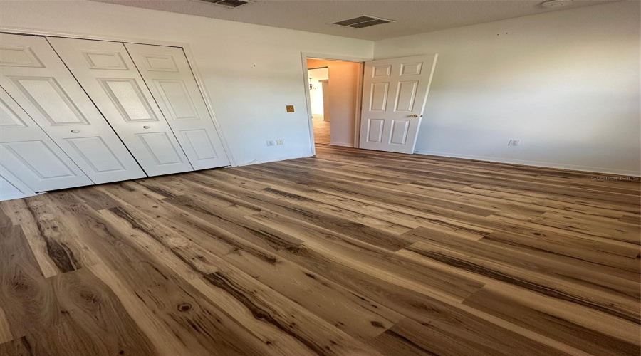 Bedroom 2 with updated flooring and paint.