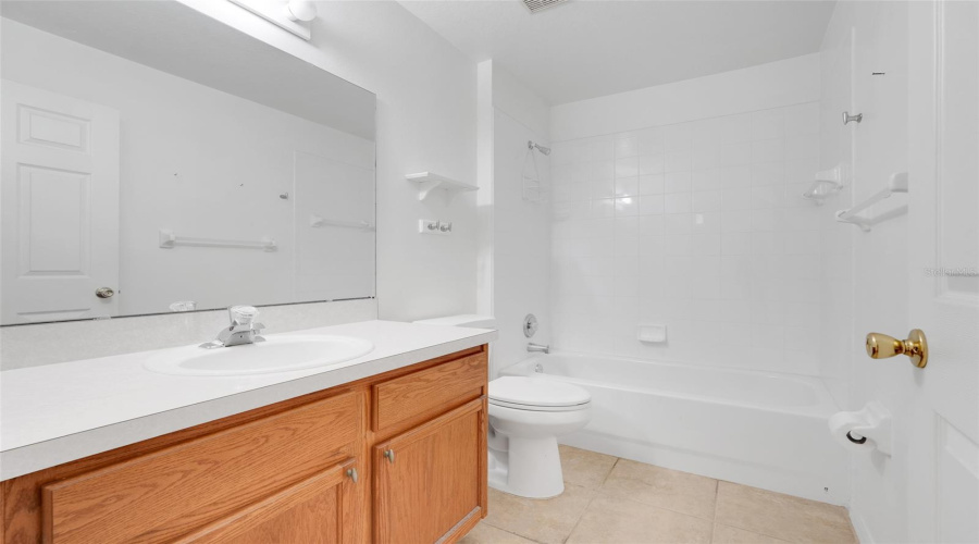 Bathroom 2 is located between Bedrooms 2 and 3 and offers a shower/tub combo.