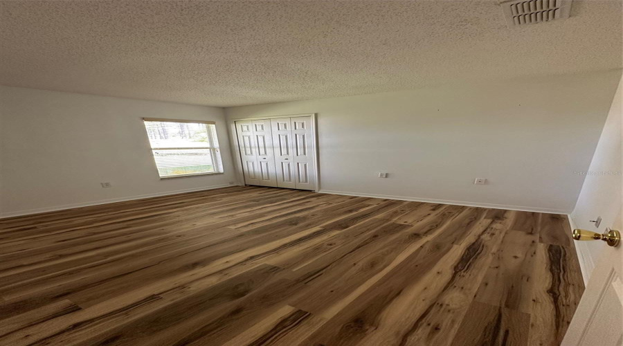 Bedroom 3 with updated flooring and paint.