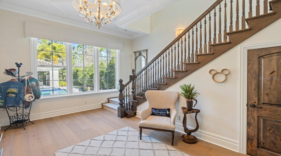 Foyer with views of pool and conservation