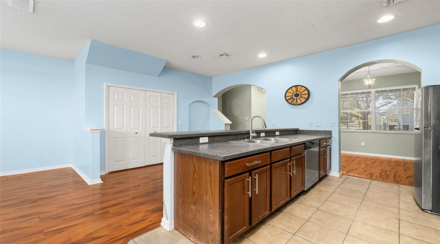 Kitchen and Living area and Double Doors that open to Laundry area.