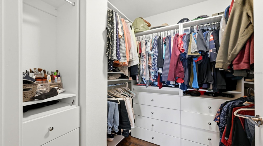 Primary Walk-In Closet with Custom Built-Ins