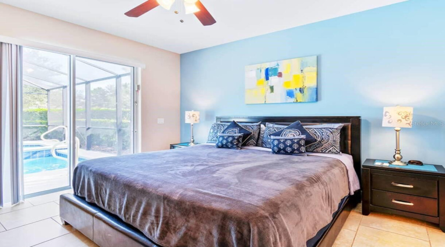 Primary bedroom with pool view