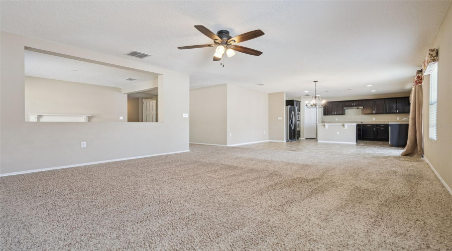 Living Room looking into Family Room, Dining, and Kitchen