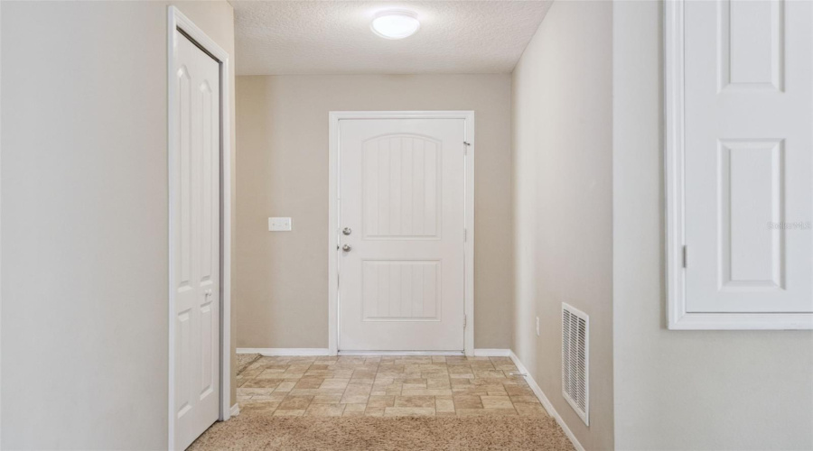 Foyer entrance with split floor plan