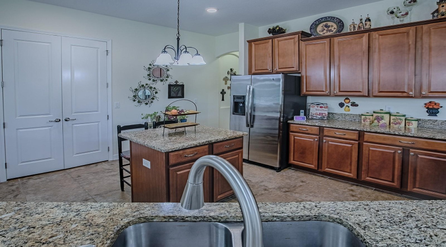 Lots of Cabinets and Granite Counters in Kitchen