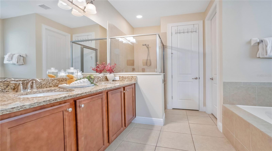 Spacious layout with separate tub and shower for added comfort.