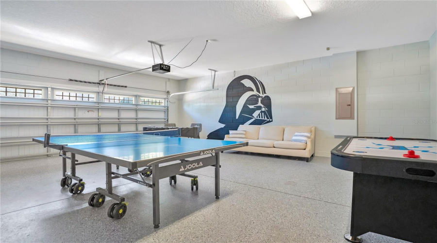 Immersive recreation space featuring ping pong and interactive gaming zones