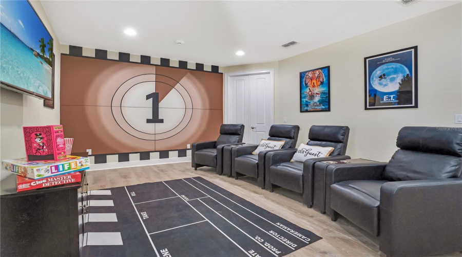 Private theater room with seating perfect for movie nights after the parks.