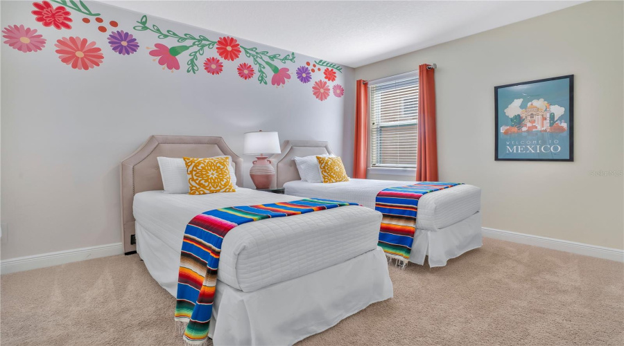 Welcome to The 'Riveria Maya' Suite - Vibrant Riviera-inspired suite featuring colorful floral accents and cheerful design details