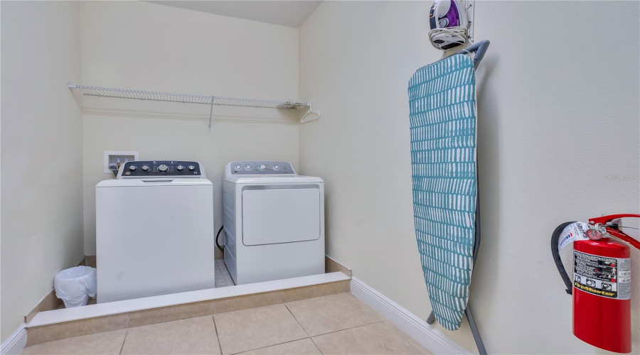 Convenient upstairs laundry room providing added functionality for large groups and extended stays