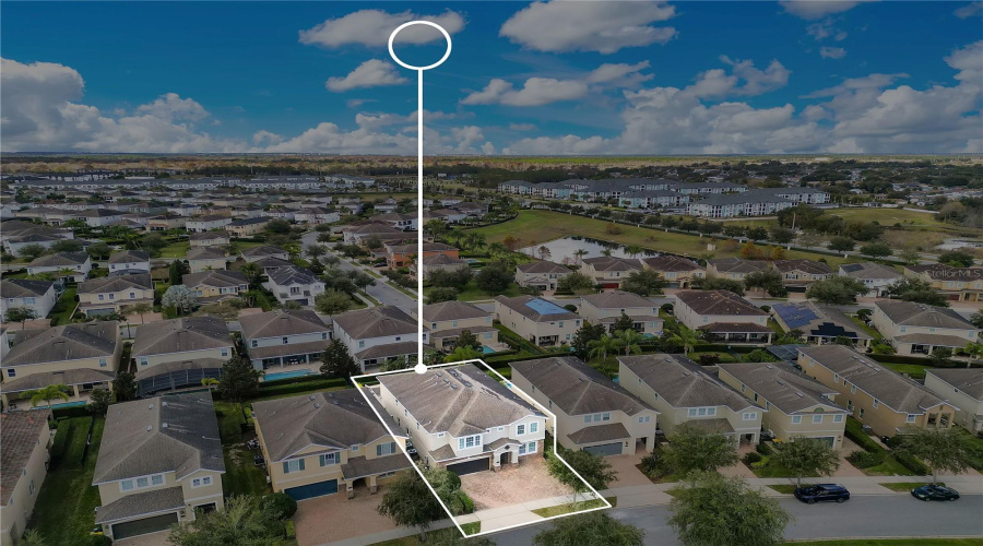 Elevated drone perspective emphasizing the home’s location within this sought-after short-term rental community