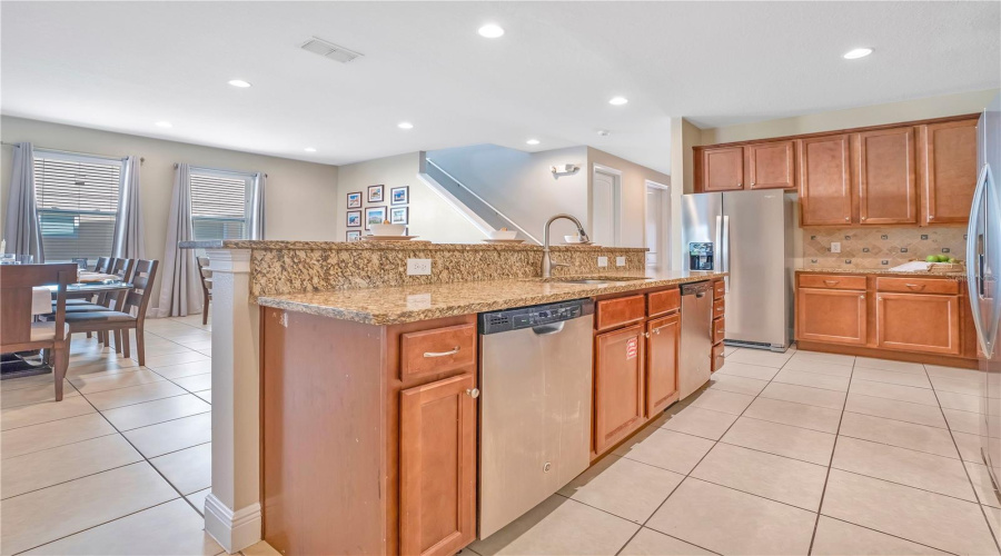 Two Stainless Steel Refrigerators and Two Dishwashers make entertaining a breeze