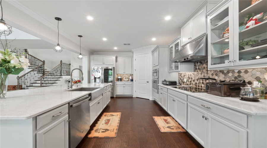 Quartz Counters, Gourmet Kitchen. Stainless steel appliances, Custom Cabinetry, Electric Stovetop