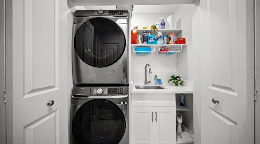 In Unit Laundry Room w/ Stacked Washer and Dryer