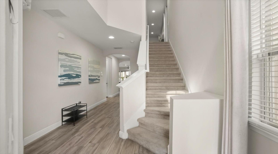 Welcoming entry and hallway leading into the main living areas of the home.