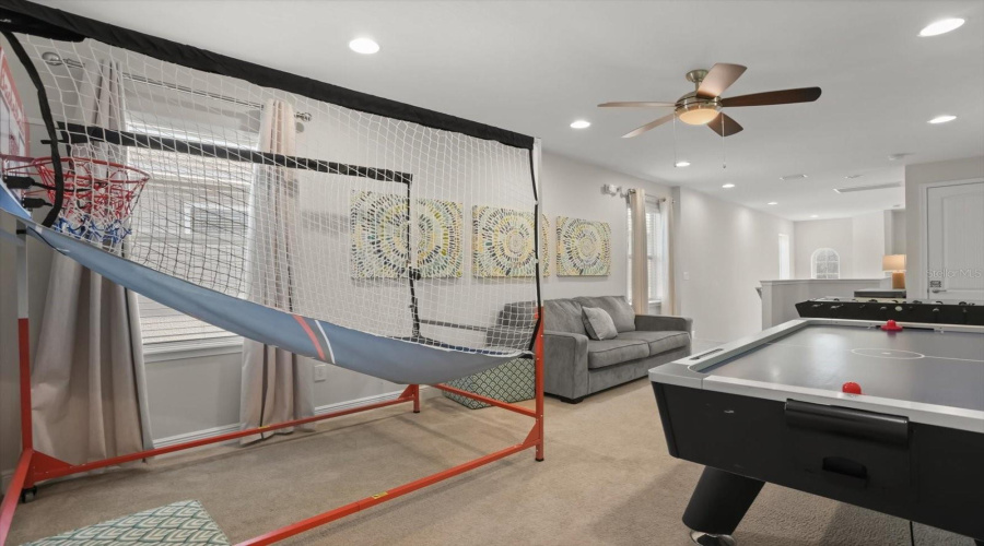 Game room area providing extra space for entertainment, making this home ideal for vacation living or short term rental guests.