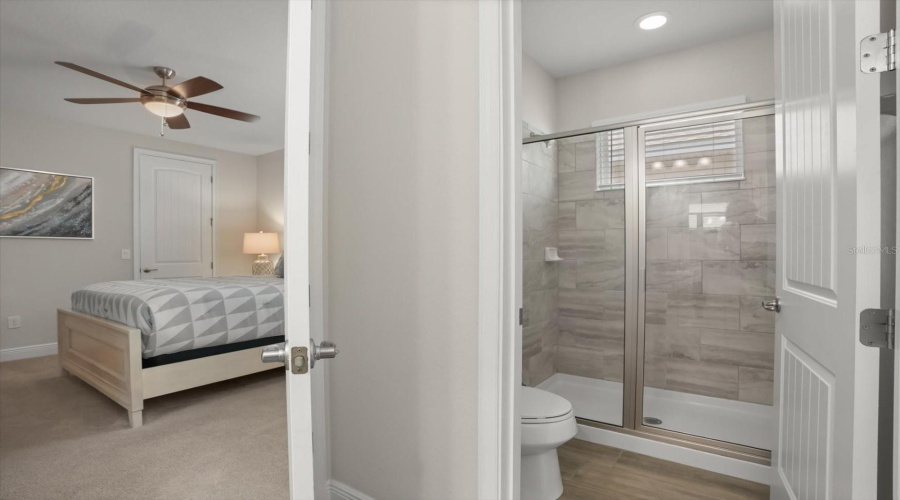 Bathroom with walk in shower and modern finishes.