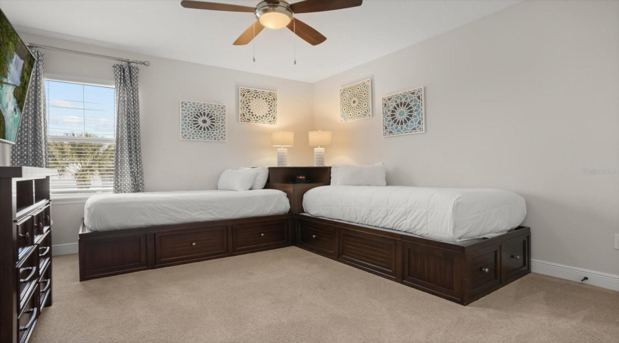 Comfortable bedroom offering flexibility for vacation guests or full time living.