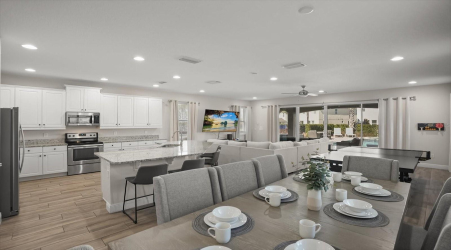 Open concept living area designed for comfort and gathering, filled with natural light and modern finishes.