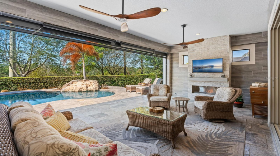 Screened in patio with built in fireplace