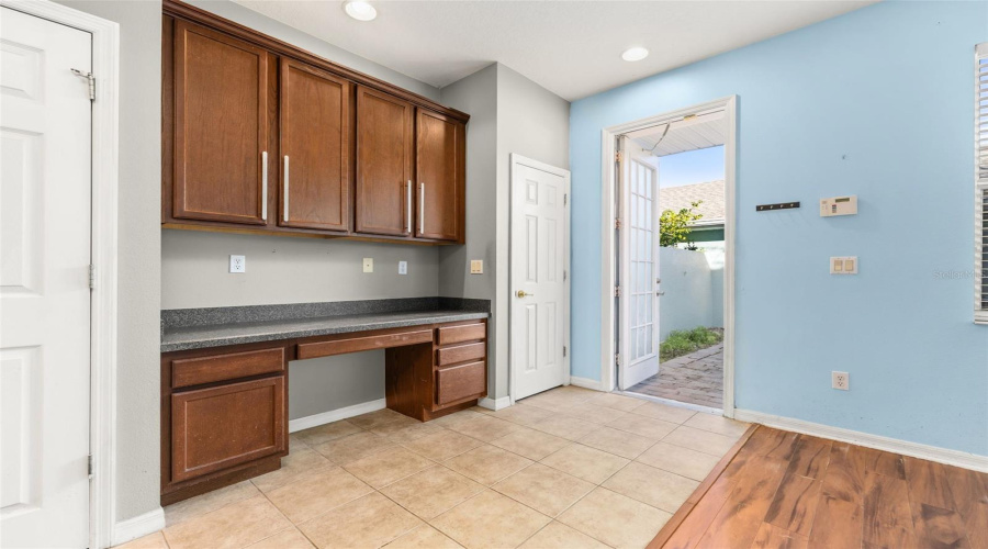 Built in desk area.  Closed door is for a coat closet.  Open door leads into private courtyard.